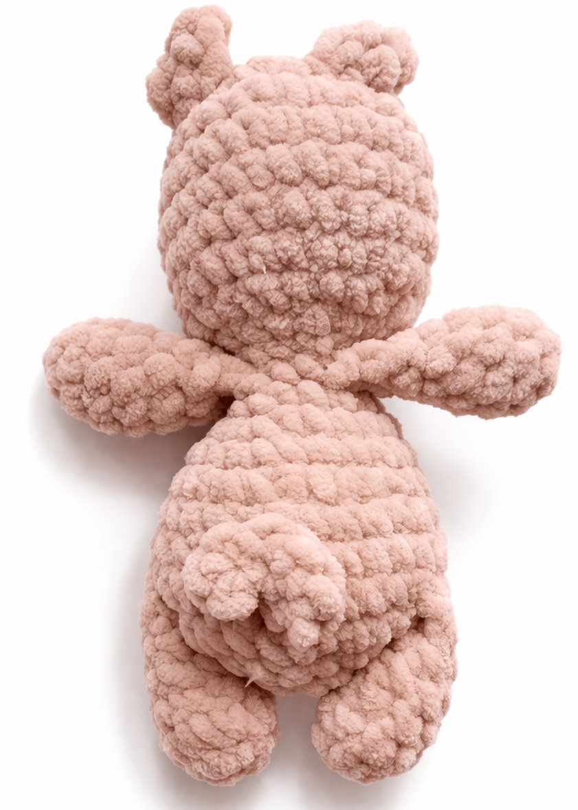 Pink crochet pig on a white background