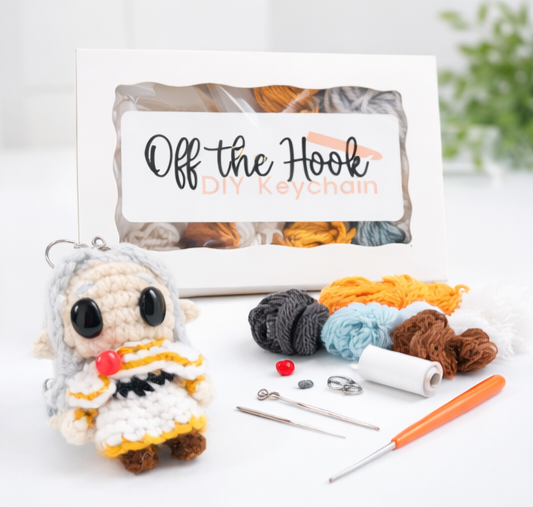 Friren chibi crochet keychain kit with yarn, crochet hook, stuffing, handmade accessories, and printed pattern booklet