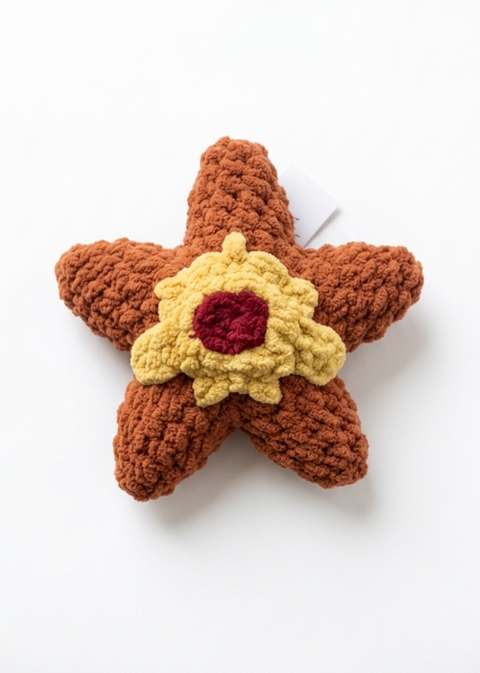 Staryu chenille plush toy. Orange star with yellow gold detailing in the center with a faux strap and a centralized faux red gem in the middle for decoration. 
