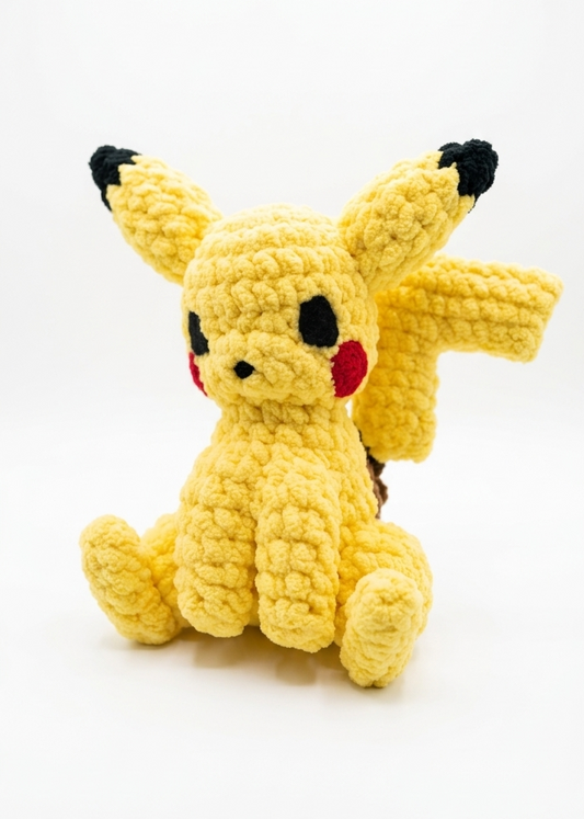 Crocheted Pikachu toy on a white background