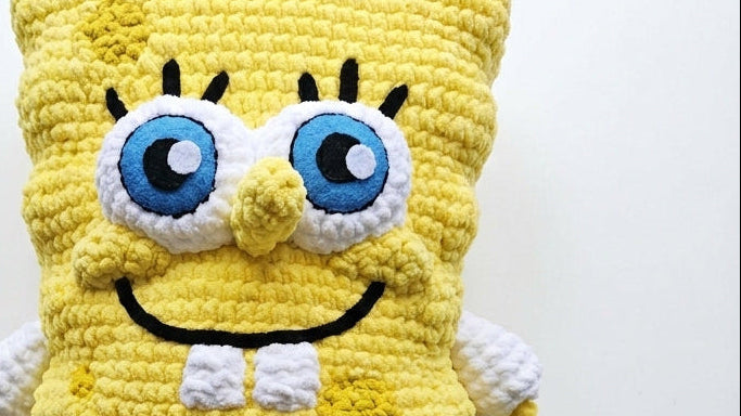 Crocheted SpongeBob SquarePants character on a white background